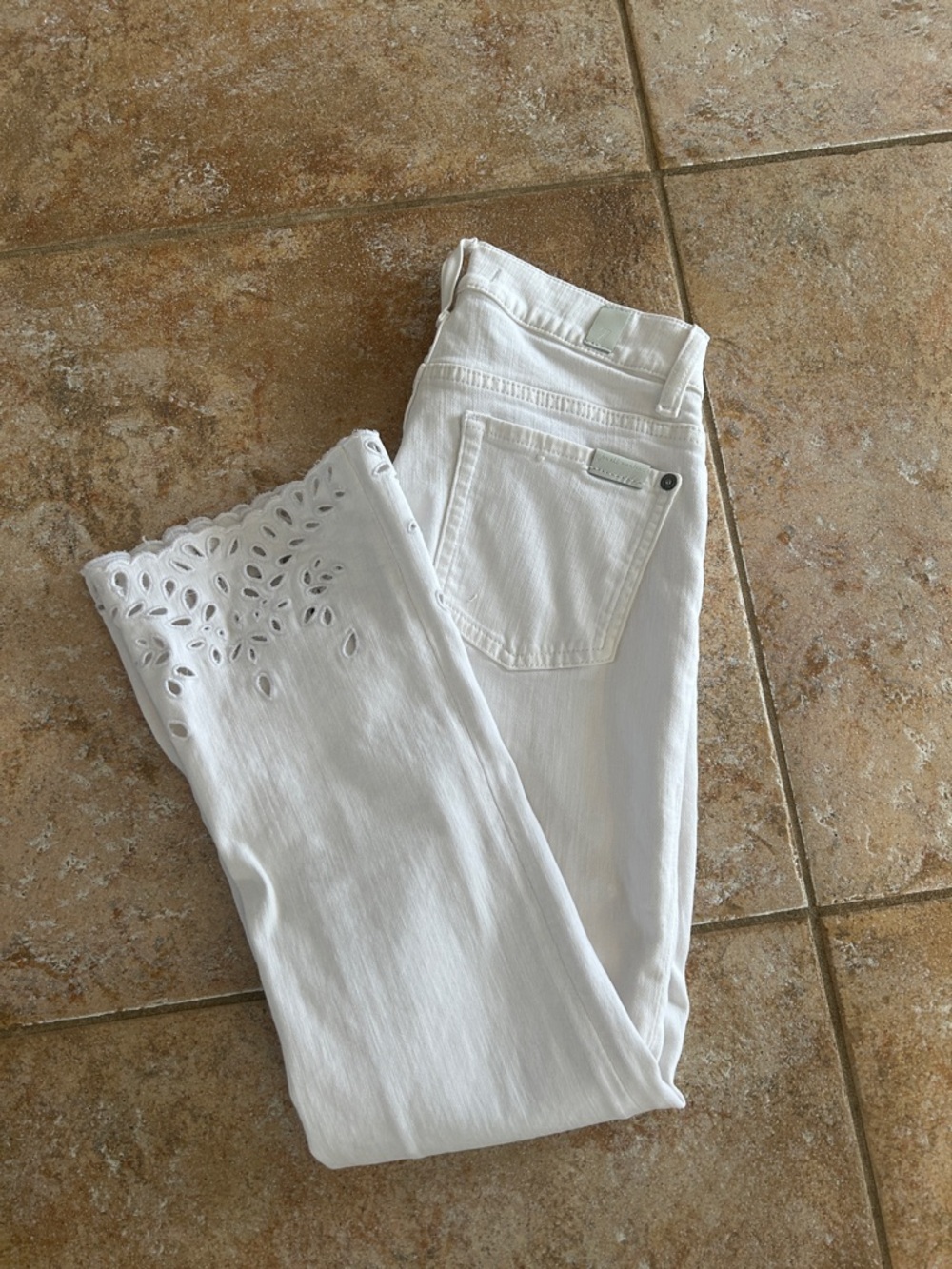 7 For All Mankind White Cropped Ankle Jeans with Laser-Cut Hem Detail.  25